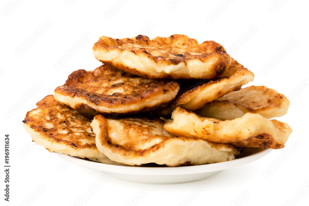 Bunch of homemade pancakes in a plate on white background Bunch of homemade pancakes in a plate on white background