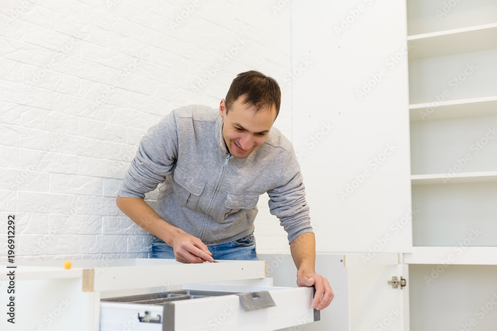 Man working on a new kitchen installation
