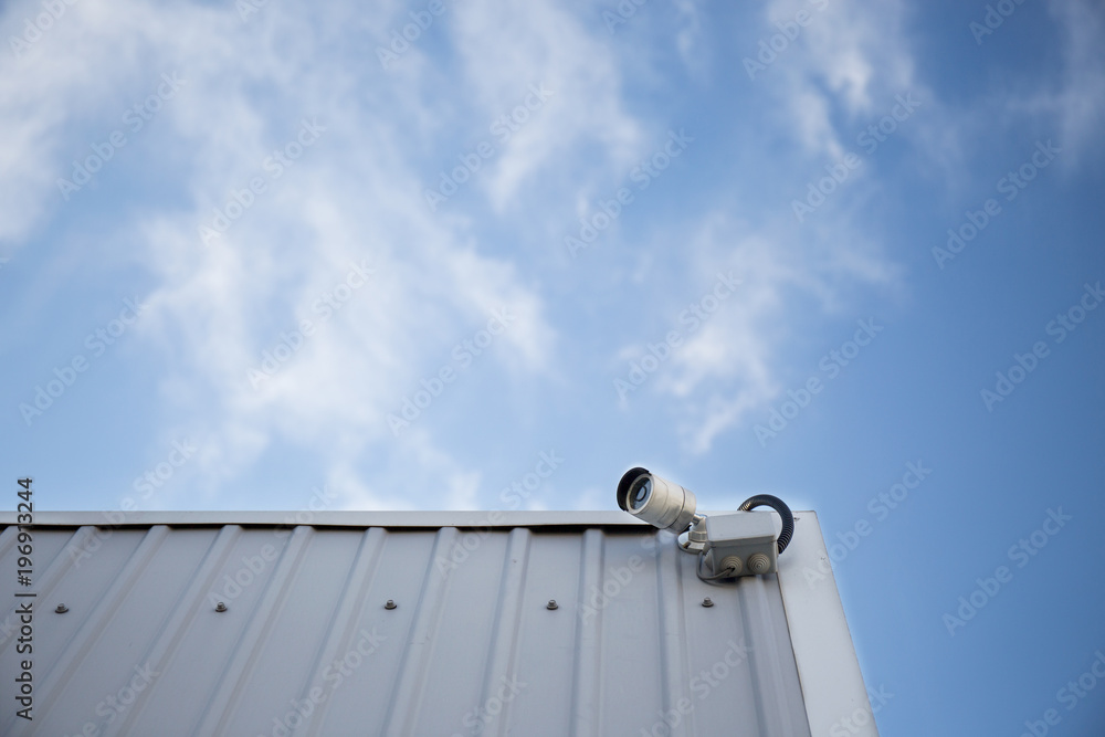 CCTV camera at the corner of an industrial building CCTV camera at the corner of an industrial building