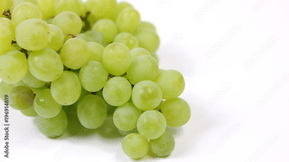 Green grapes on white background with copy space Green grapes on white background with copy space