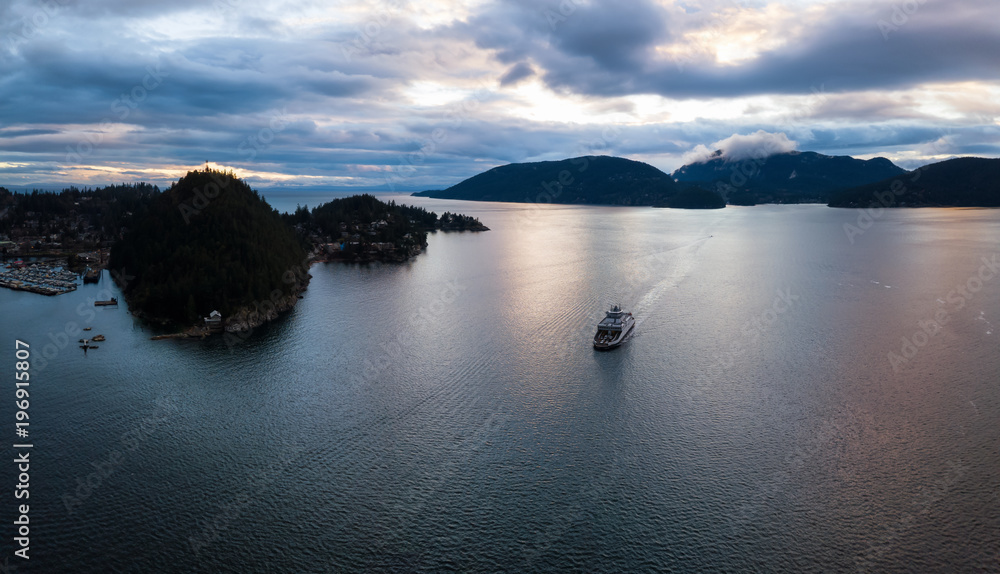 Aerial panoramic view of Horseshoe Bay in Howe Sound during a vibrant cloudy sunset. Taken West Vancouver, British Columbia, Canada.