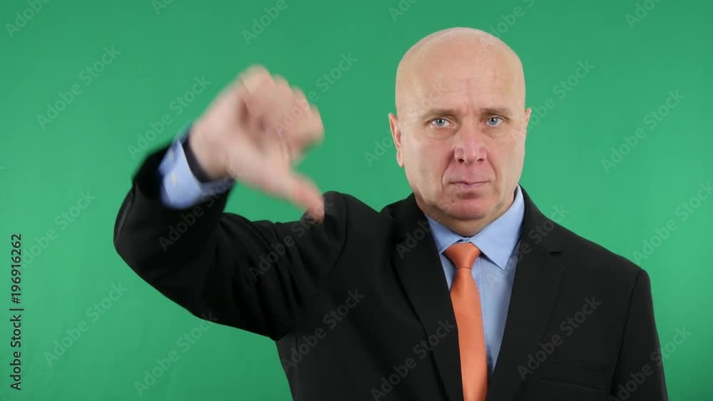 Serious and Upset Businessman Make Dislike Sign a Disapprove Hand Gestures Serious and Upset Businessman Make Dislike Sign a Disapprove Hand Gestures