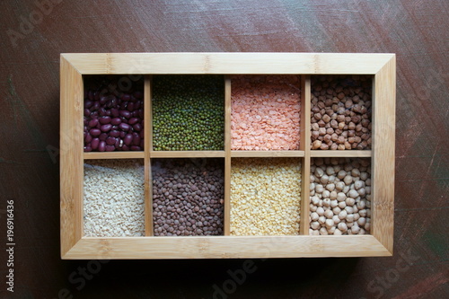 A box of different kinds of lentils photo