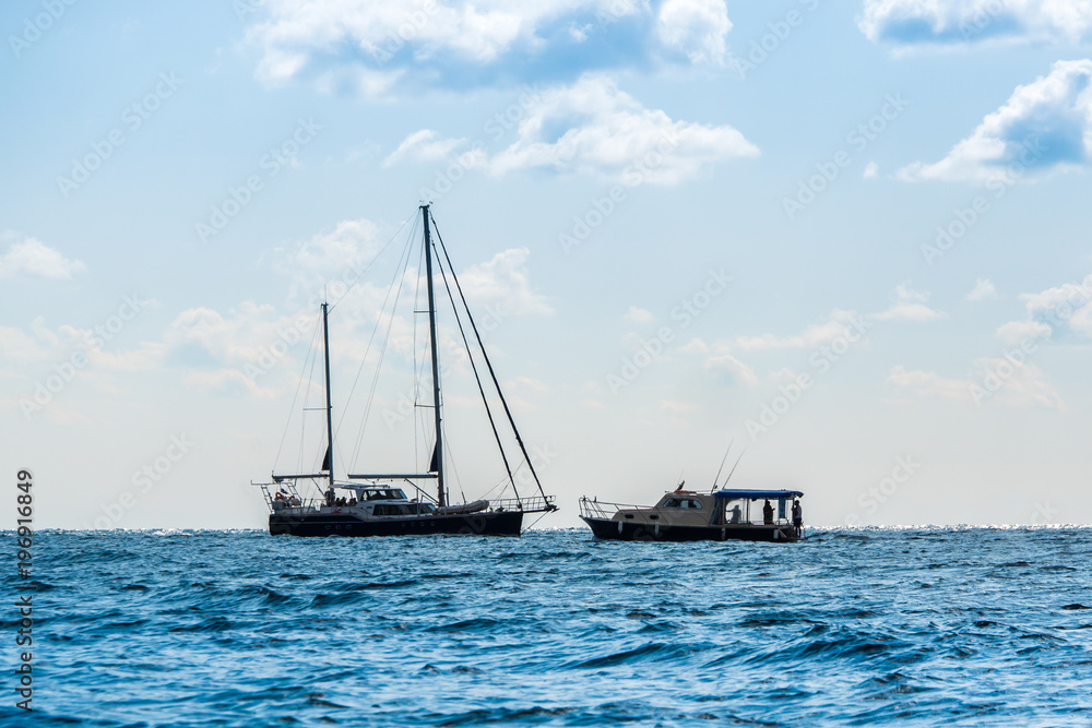 the rocky shore and sailboat at sea. Fiolent, Crimea the rocky shore and sailboat at sea. Fiolent, Crimea