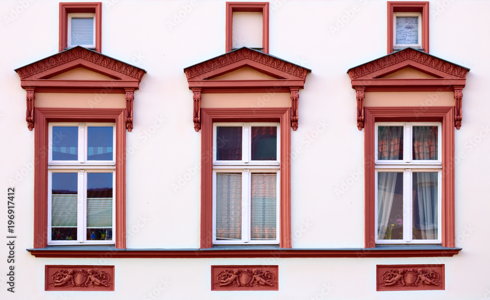Fototapeta premium Ornaments and windows on a historic house from 1888 in Greifswald, Germany