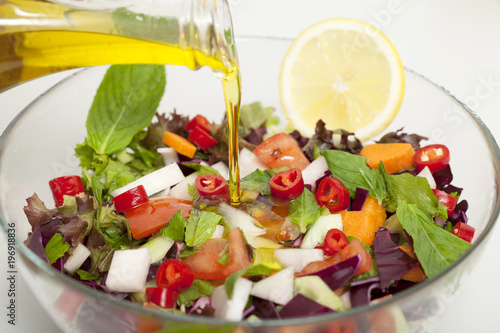 olive oil with salad bowl