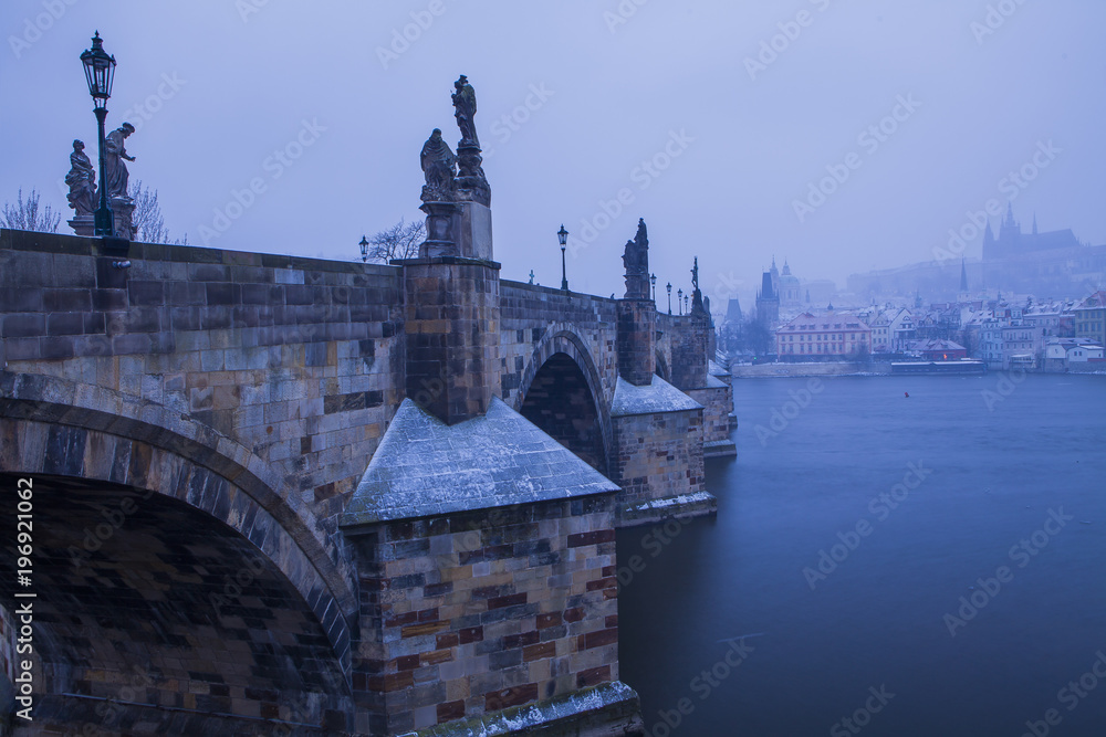 Obraz premium Winter cityscape, snowing in Prague, Czech Republic 