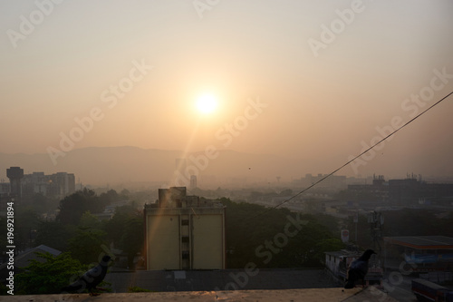 Landscape aerial view of Navi Mumbai in seawoods at evening in sunset. smoke and smog photo