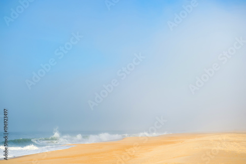 Picturesque scenery seascape of foggy misty abandoned wild beach. Art beautiful landscape of deserted cost with ocean waves. Colorful nature paysage. Desolate mediterranean costline. Fairy tale view.