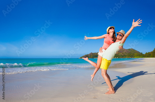 young family in love having fun at tropical Cote d Or beach. Praslin, Seychelles © el.rudakova