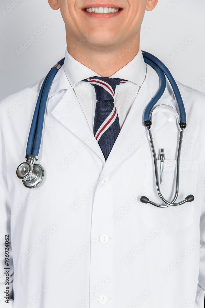 Professional medical team posing, doctor's lab coat and stethoscope close up Professional medical team posing, doctor's lab coat and stethoscope close up