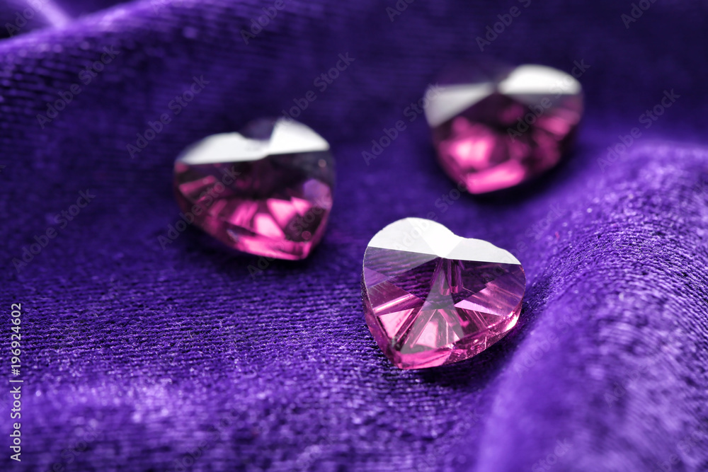 Precious stones for jewellery on purple velvet Precious stones for jewellery on purple velvet