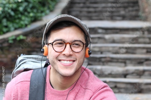 Retro styled ethnic male listening to music