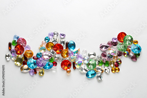 Composition of colorful precious stones for jewellery on white background