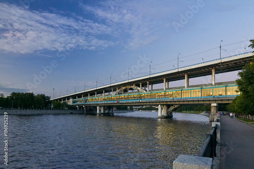 Metro bridge over the river at dusk