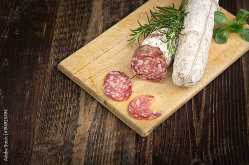  Dried salami with rosemary and basil.