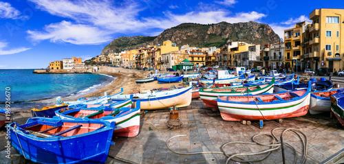 Traditional fishing village Aspra with colorful boats in Sicily. Italy