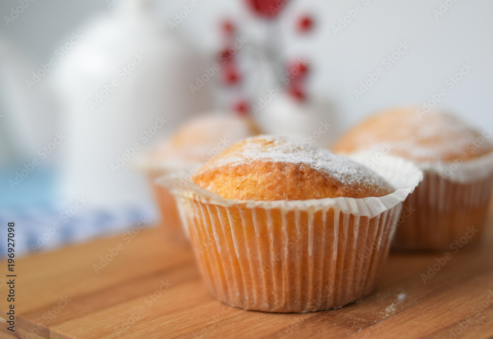 freshly baked cupcake sprinkled with powdered sugar freshly baked cupcake sprinkled with powdered sugar
