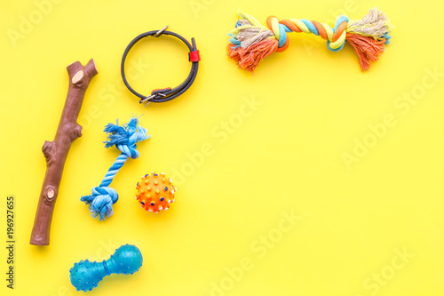cats and dogs toys and acessories for pets yellow background top view mockup