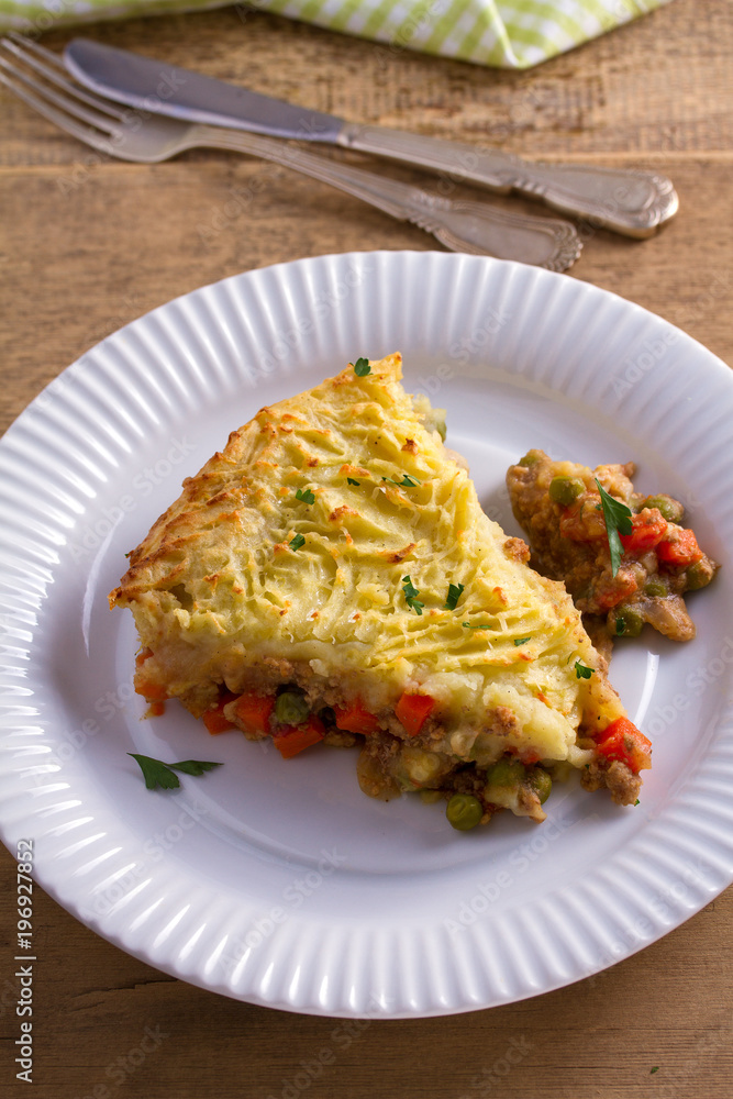 Traditional shepherd pie - popular dish in Ireland. Beef meat, mashed potato, cheese, carrot, onion and green peas casserole