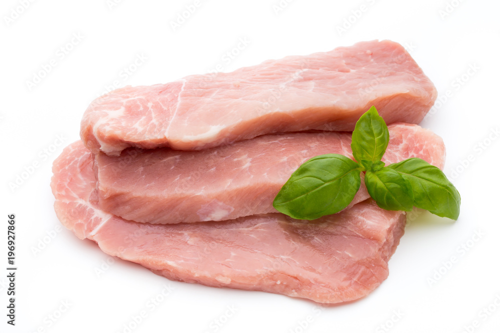 Fresh pork fillet with basil on a white background. Fresh pork fillet with basil on a white background.
