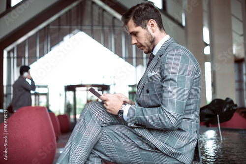 Smartly dressed businessman, smiling photo