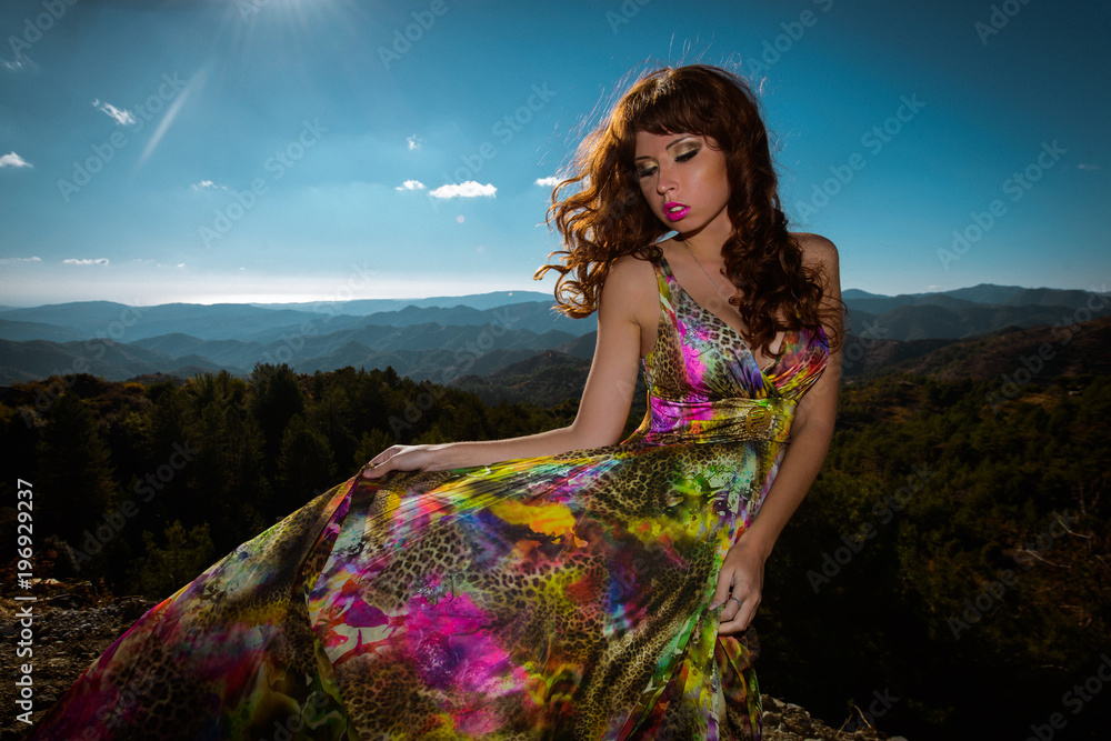 Φωτογραφία Outdoor summer portrait of young beautiful lady wearing long evening dress in bright colors and colorful print