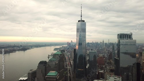 Freedom Tower aerial moving downward in Manhattan New York City with beautiful clouds in sky - NYC 4K and 1080 HD