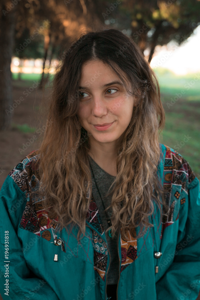 An attractive girl having fun in a sunny day inside a park in Seville, Spain. An attractive girl having fun in a sunny day inside a park in Seville, Spain.