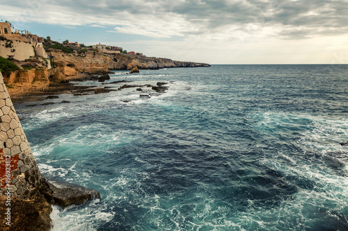 Rocky shore of the beautiful blue sea