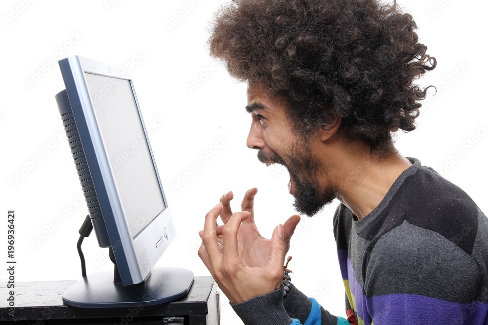 Afro man behind a computer