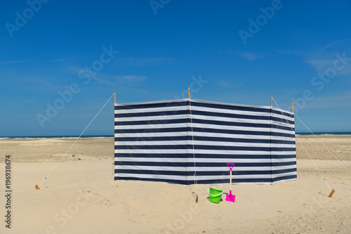 Striped windbreak at the beach photo