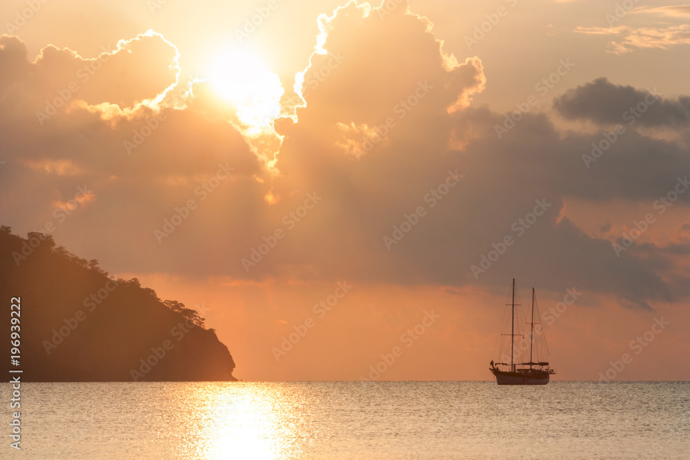 Beautiful seascape - view of morning sea with a sailboat in the bay of Adrasan, coast of the Mediterranean Sea, Antalya Province, Turkey.