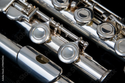 Close up of the silver plated musical instrument flute