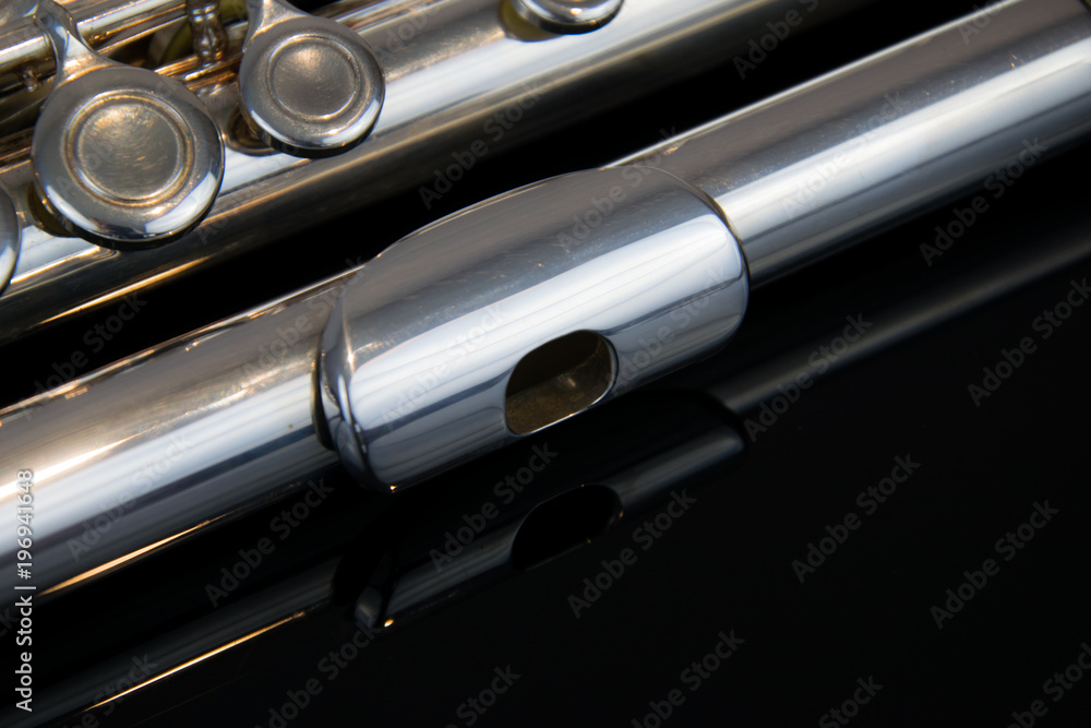 Naklejka premium Close up of the silver plated musical instrument flute