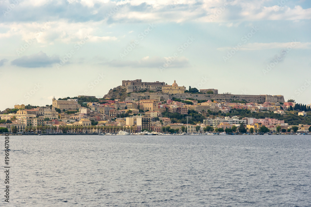 Milazzo town seen from the sea at sunset