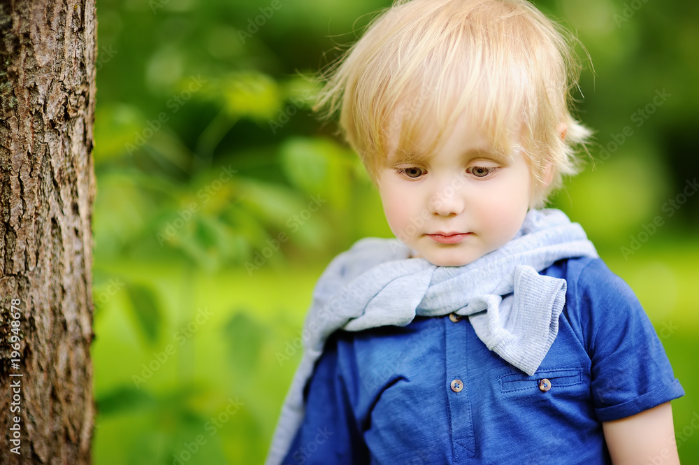 Portrait of little boy during stroll in the forest Portrait of little boy during stroll in the forest