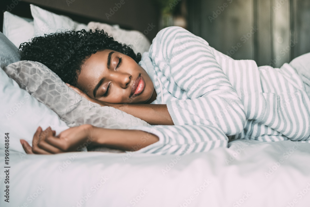 Close Up Of A Pretty Black Woman With Curly Hair Sleeping In Bed Closed