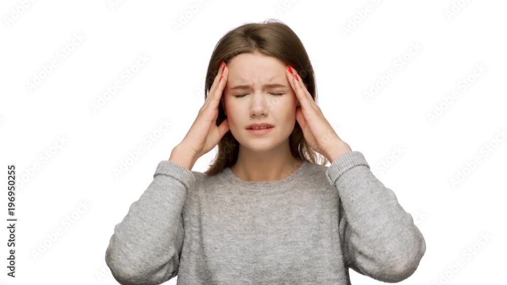 Horizontal portrait of tired woman 20s feeling sick massaging temples with fingers and suffering from strong headache or migraine, over white background. Concept of emotions Horizontal portrait of tired woman 20s feeling sick massaging temples with fingers and suffering from strong headache or migraine, over white background. Concept of emotions