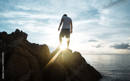 Photography Guy Watching the Sunset from the Rocks