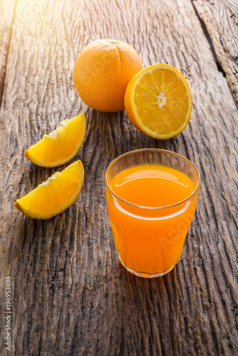 Glass of Fresh Orange Juice on grunge wooden table