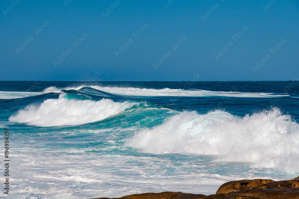 Fototapeta premium Big ocean wave with clear blue sky