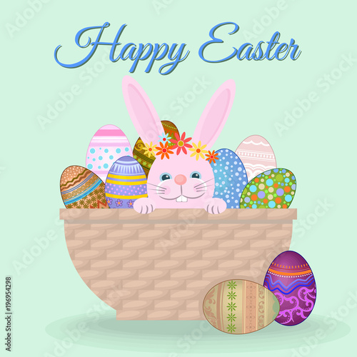 Cute rabbit and easter eggs in brown basket on green background.