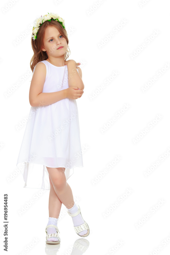 Fashionable little girl in a dress