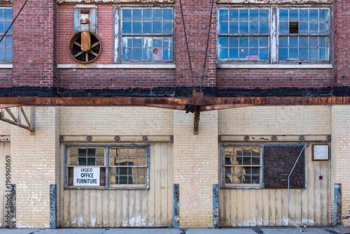 exterior of old abandoned brick warehouse in inner city