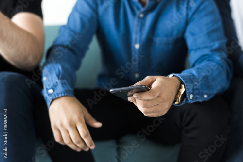 Closeup of man using mobile phone