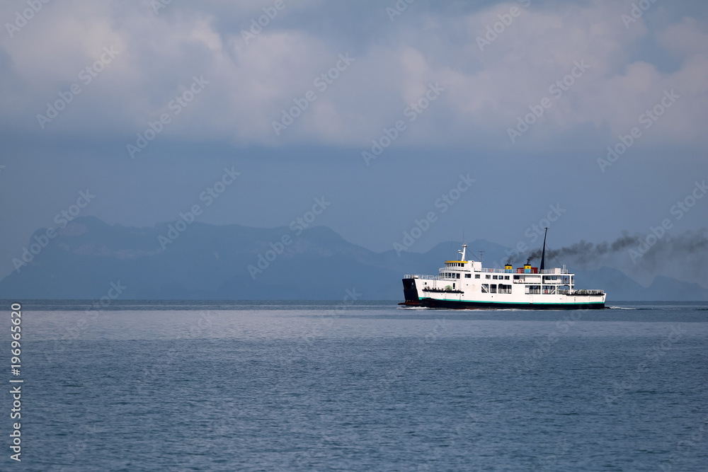 Ferry sailing in the sea and pollution from the engine