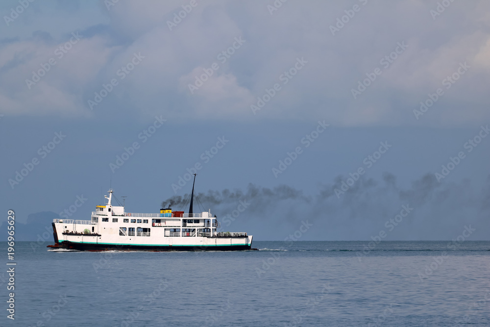 Ferry sailing in the sea and pollution from the engine