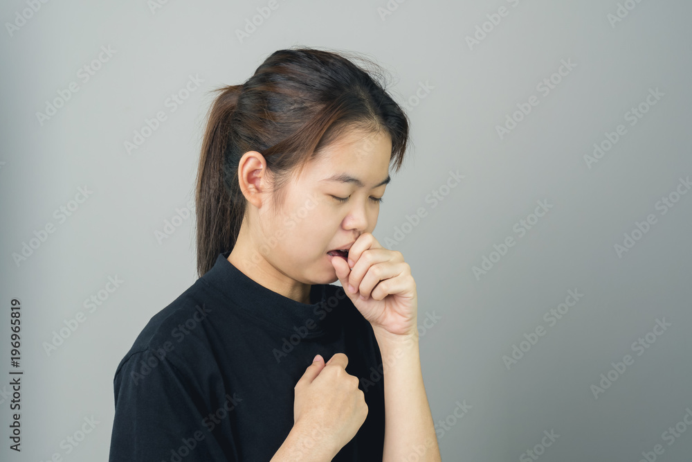 Φωτογραφία Close up of women are cough and irritation around the neck, a gray background gives soft light
