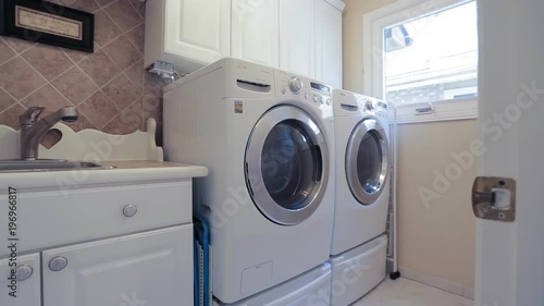 Wallpaper Mural laundry. A washing and dryer machine at home Torontodigital.ca